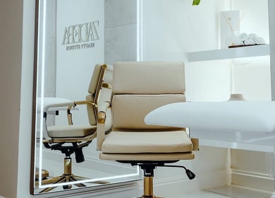 Elegant treatment room at Brows or Brows in London, England, GB with a plush chair and serene decor.