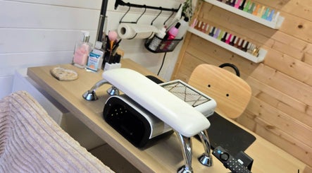 Manicure station at Nailed By Moo, Oldham, England, GB, showcasing tools and color display.
