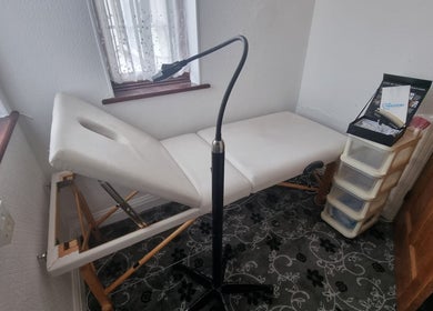 Massage table at Léwa Studio by Shellz, London, England, GB, set for treatments in a serene room.