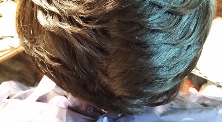 Top view of styled hair at Jae's Bare Bar, Ridgeland, Mississippi, US, showcasing sleek hair design.