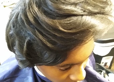 Elegant hairstyle crafted at Jae's Bare Bar in Ridgeland, Mississippi, US, showcasing smooth layered waves.