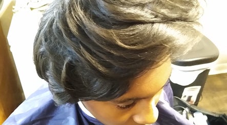 Elegant hairstyle crafted at Jae's Bare Bar in Ridgeland, Mississippi, US, showcasing smooth layered waves.