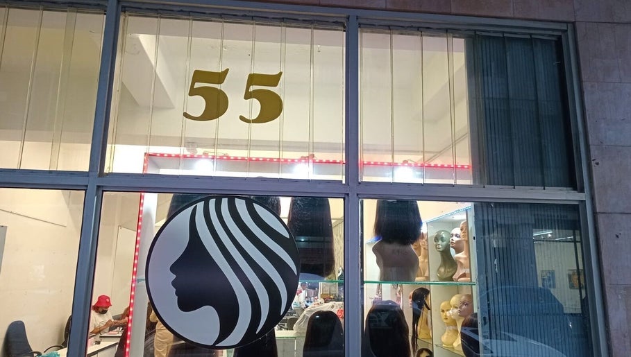 Front of Lavish Looks Hair Studio in Cape Town, Western Cape, ZA showcasing wigs and elegant logo.