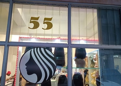 Front of Lavish Looks Hair Studio in Cape Town, Western Cape, ZA showcasing wigs and elegant logo.