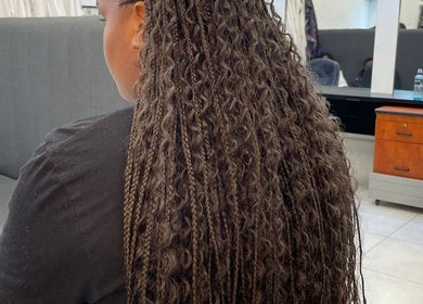 Intricate braids on a client at Lavish Looks Hair Studio in Cape Town, Western Cape, ZA, showcasing salon expertise.