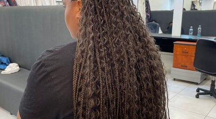 Intricate braids on a client at Lavish Looks Hair Studio in Cape Town, Western Cape, ZA, showcasing salon expertise.