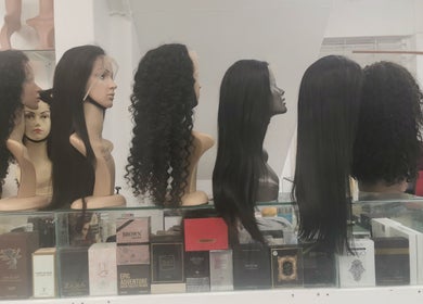 Diverse wig styles on display at Lavish Looks Hair Studio in Cape Town, Western Cape, ZA.