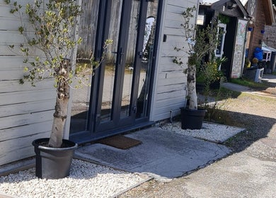 Cozy Nails by Claire exterior with potted plants, Par, England, GB.