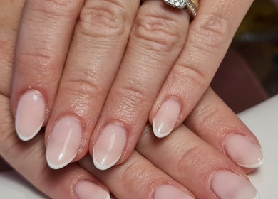 Elegant French manicure nails at Nails by Claire, Par, England, GB, showcasing precision and artistry.