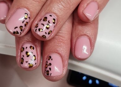 Leopard print nail art design at Nails by Claire in Par, England, GB. Elegant and stylish manicure.