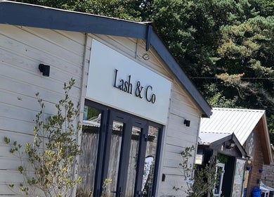 Exterior of beauty venue in Par, England, GB with lush greenery, providing a serene setting at Nails by Claire.