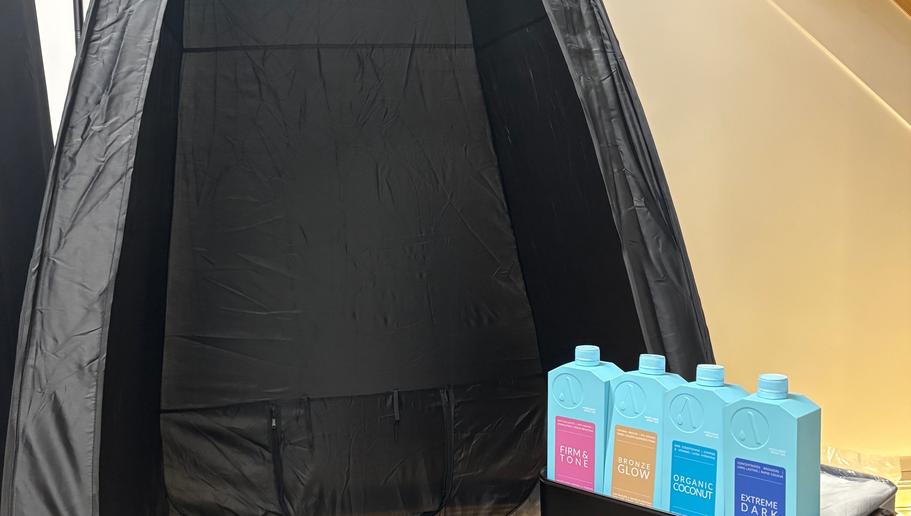 Spray tan booth with tanning solutions at By Chloe Beauty, Ballina, County Mayo, IE.