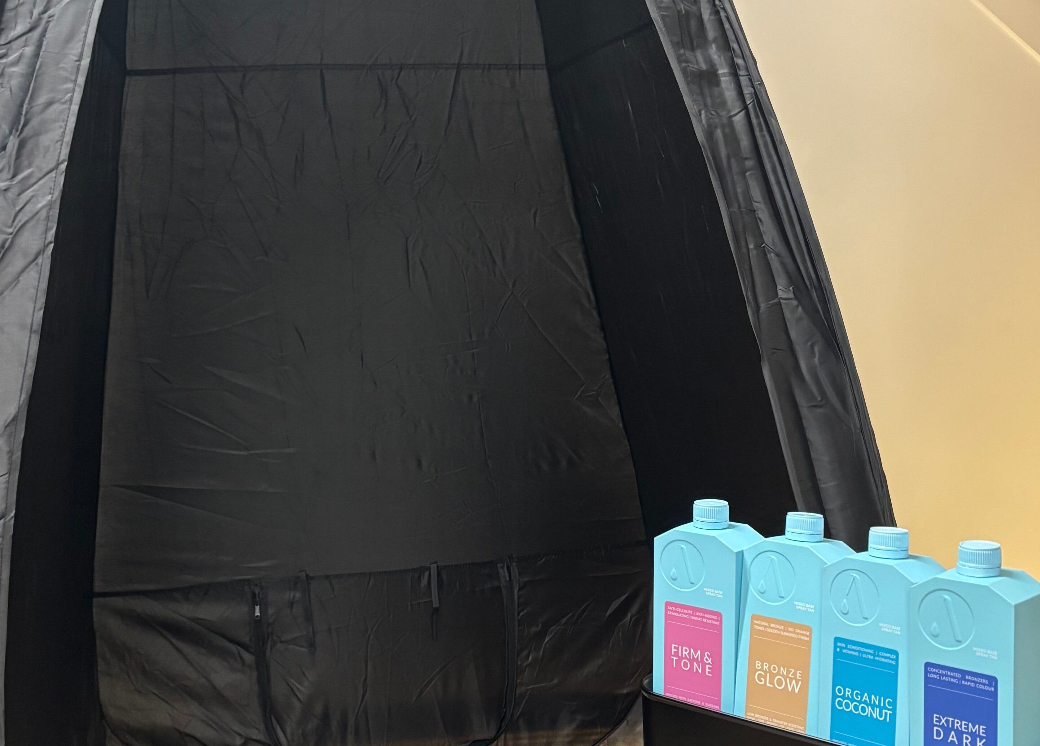 Spray tan booth with tanning solutions at By Chloe Beauty, Ballina, County Mayo, IE.