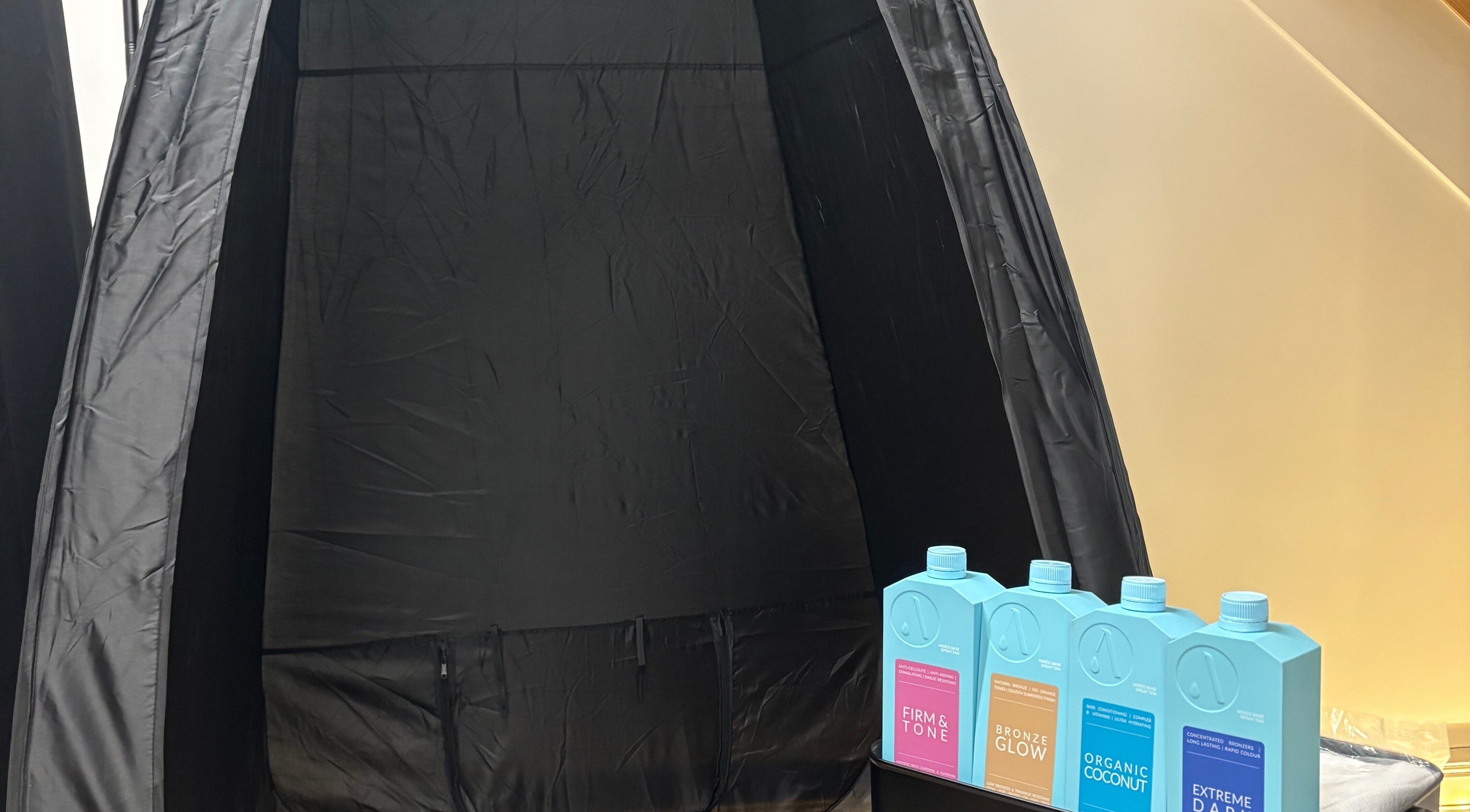 Spray tan booth with tanning solutions at By Chloe Beauty, Ballina, County Mayo, IE.