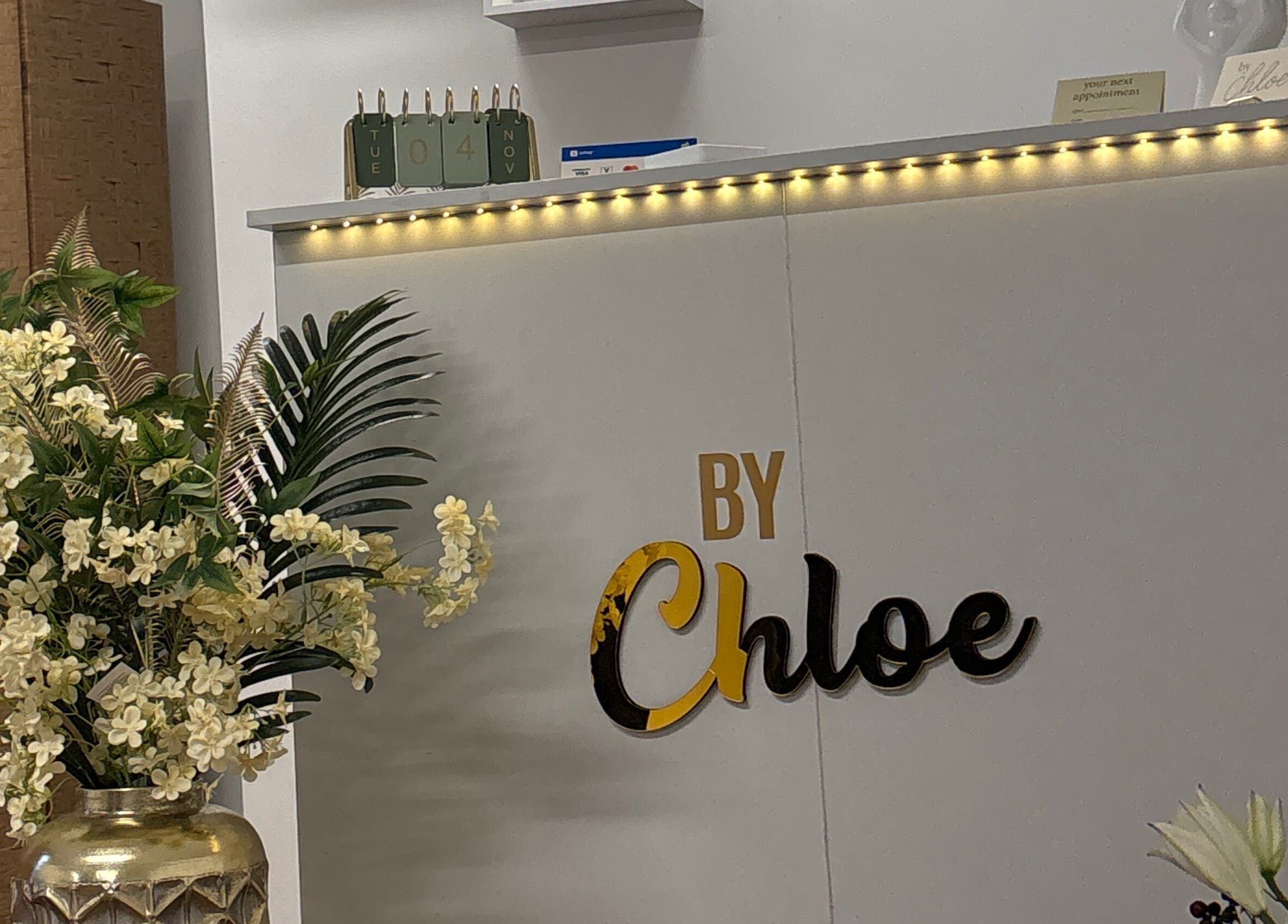 Elegant entrance at By Chloe Beauty with flowers and signage, Ballina, County Mayo, IE.
