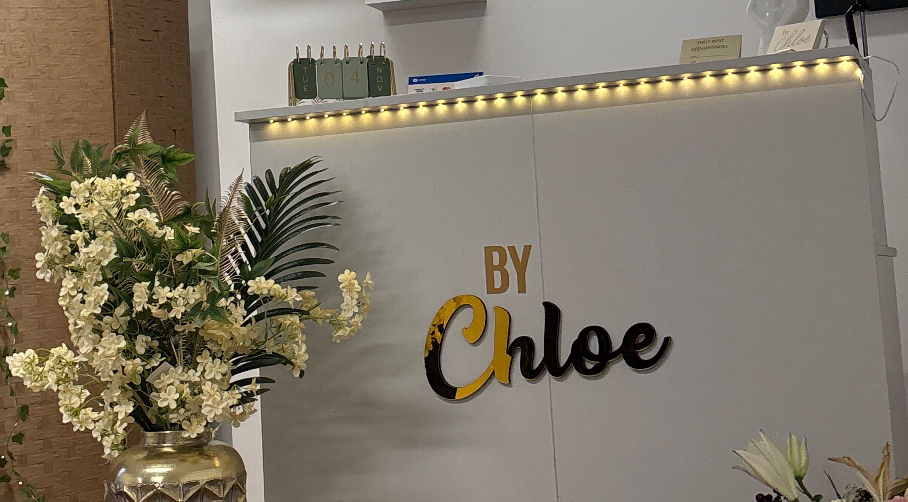 Elegant entrance at By Chloe Beauty with flowers and signage, Ballina, County Mayo, IE.