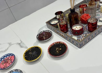 Luxurious aromatic setup with candles and scrubs at Bella Donna Saloon, Ajman, Ajman, AE.