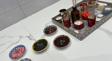 Luxurious aromatic setup with candles and scrubs at Bella Donna Saloon, Ajman, Ajman, AE.