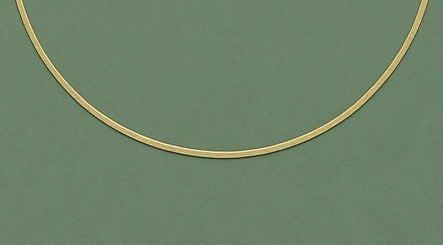 Gold line on green background representing elegance at By Shanelle, Glasgow, Scotland, GB.