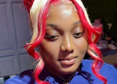 Goddess Touch highlights a woman's vibrant red and blonde hairstyle in Georgetown, Demerara-Mahaica, GY.