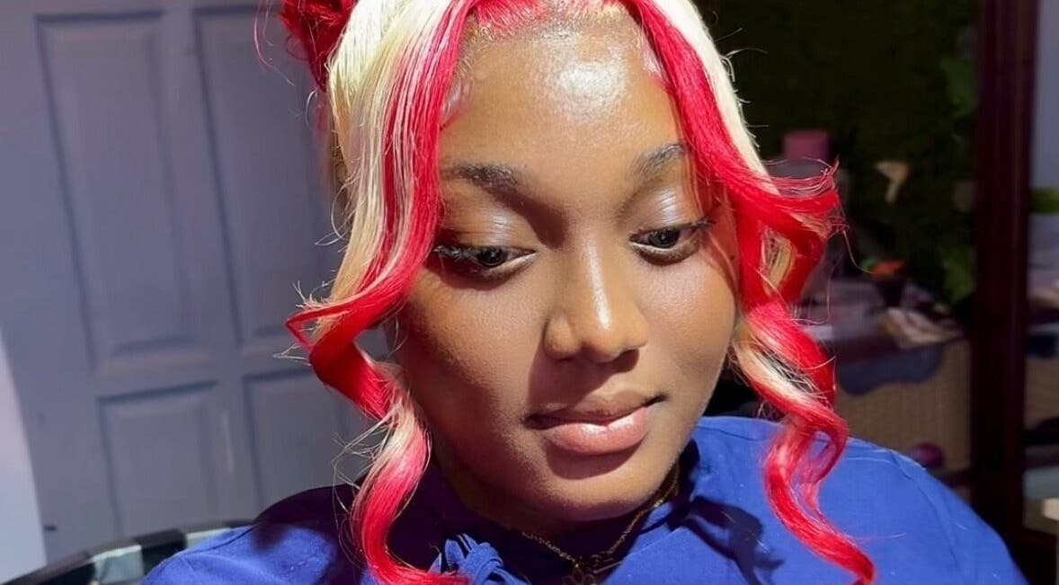 Goddess Touch highlights a woman's vibrant red and blonde hairstyle in Georgetown, Demerara-Mahaica, GY.