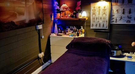 Cozy massage room at Simon's Massage Therapy, Killinghall, England, GB with relaxing decor and ambient lighting.
