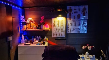 Cozy massage room setup at Simon's Massage Therapy, Killinghall, England, GB with ambient lighting and decor.
