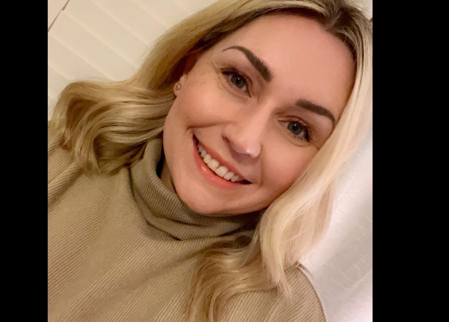 Smiling customer at Chloe Vallance Hairdressing in Northwich, England, GB.