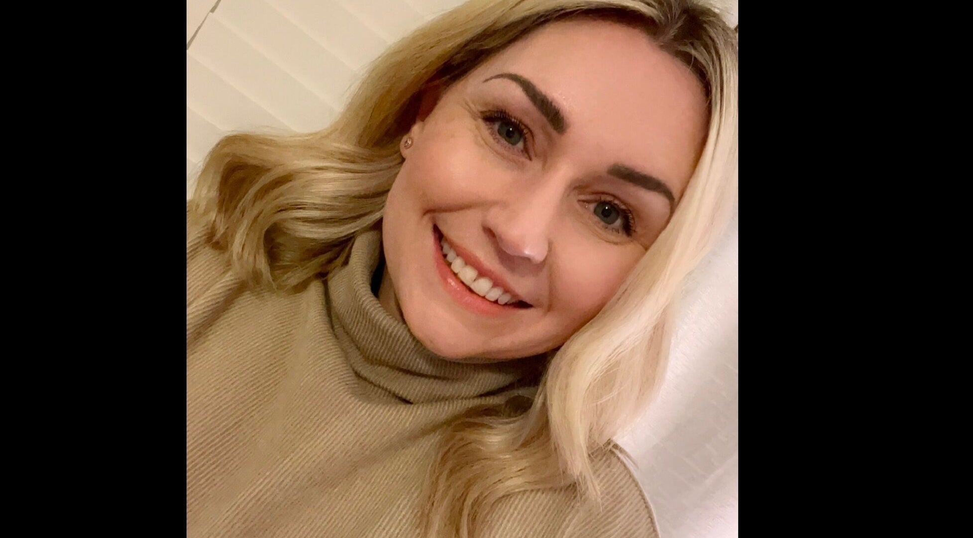 Smiling customer at Chloe Vallance Hairdressing in Northwich, England, GB.