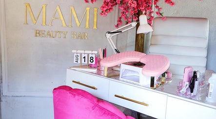Mami beauty bar's stylish workspace in Alberton, Gauteng, ZA featuring pink decor and beauty tools.