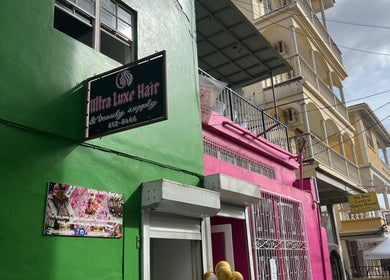 Colorful storefronts near The Beauty Cuisine, Roseau, Saint George Parish, DM.