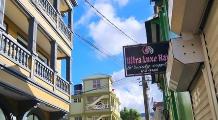 Street view near The Beauty Cuisine in Roseau, Saint George Parish, DM with surrounding architecture.