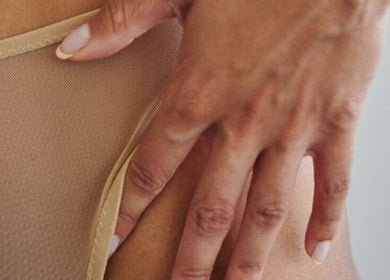 Close-up of a hand on skin at Glow by Jacinda, Gledswood Hills, New South Wales, AU.
