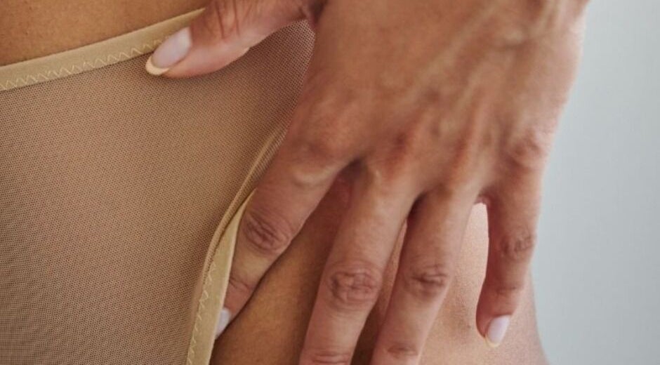 Close-up of a hand on skin at Glow by Jacinda, Gledswood Hills, New South Wales, AU.
