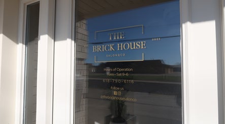 Entrance view of Zoetic Beauty in Marion, Illinois, US displaying hours and contact info.