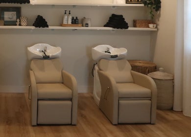 Luxurious wash stations at Zoetic Beauty in Marion, Illinois, US. Inviting and serene for premium salon care.