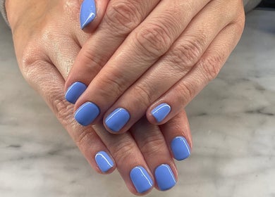 Elegant blue nails manicure at Nailcita_bysim, London, England, GB, showcasing professional nail care.