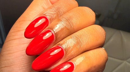 Glossy red manicure at Nailcita Bysim in Hornchurch, England, GB, showcasing vibrant nail art.