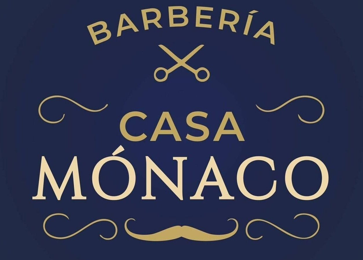 Logotipo dorado de Casa Mónaco en Cuenca, Azuay, EC con diseño de tijeras y bigote.