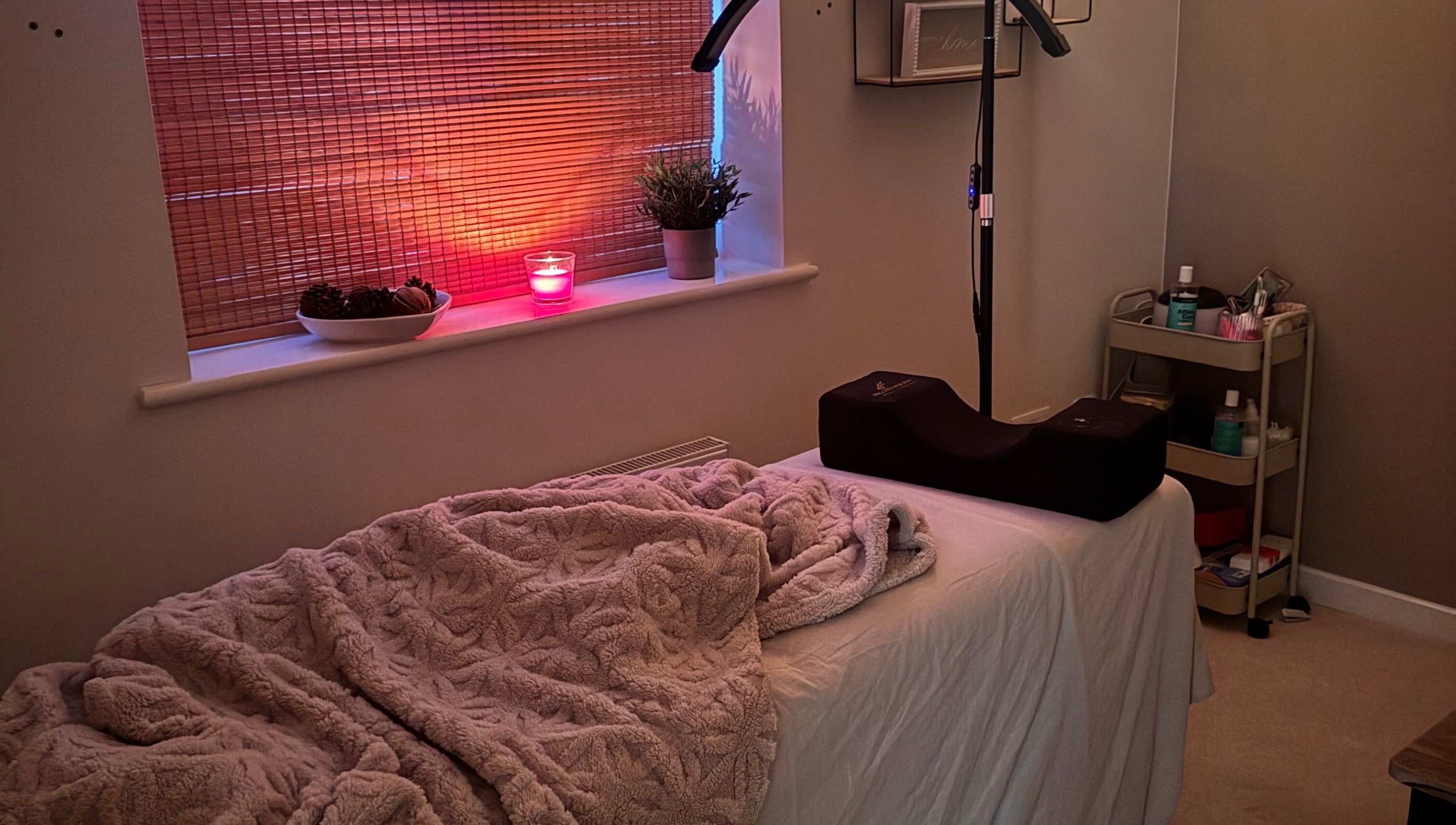 Relaxing treatment room at Brows By Ru, Royal Wootton Bassett, England, GB with ambient lighting and cozy decor.