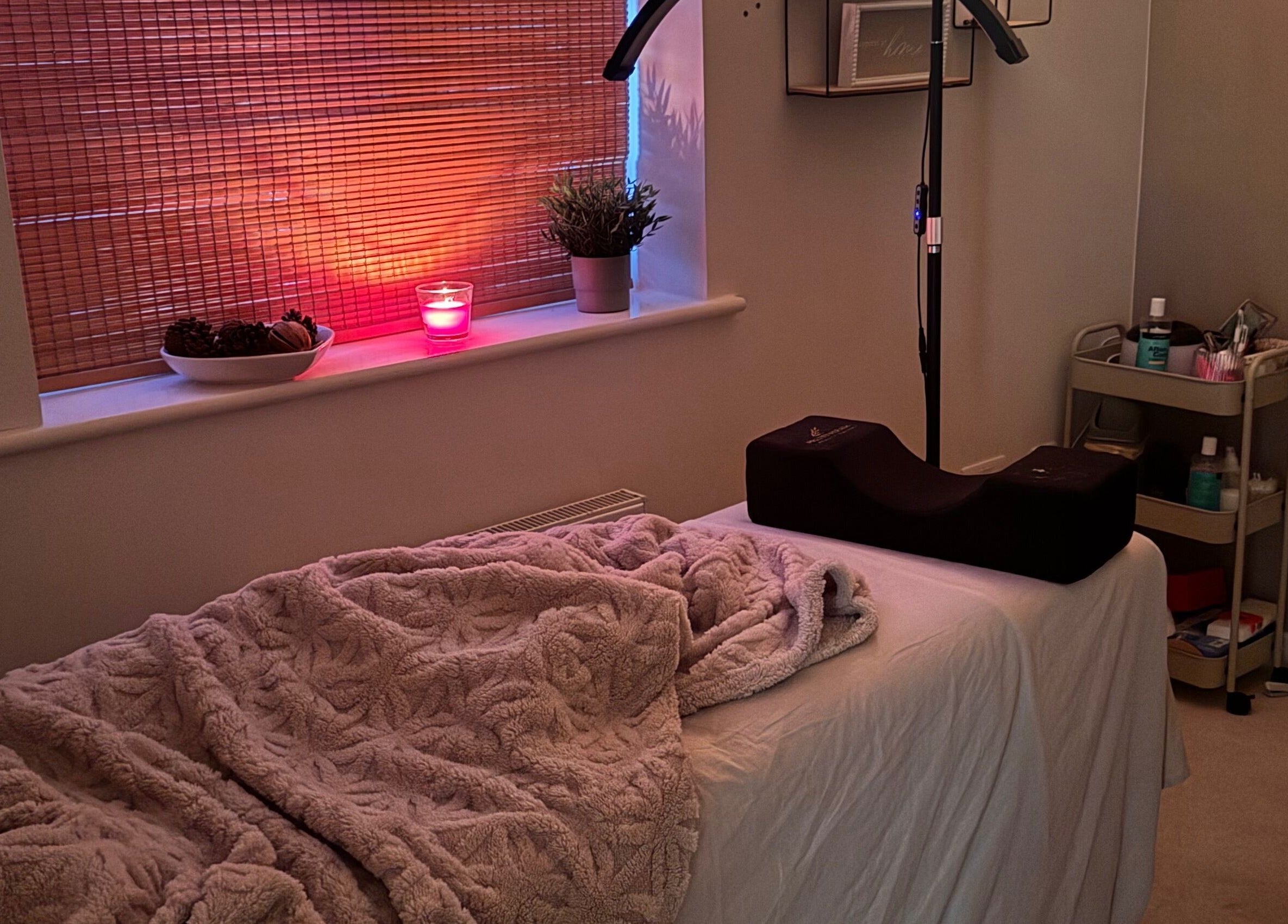 Relaxing treatment room at Brows By Ru, Royal Wootton Bassett, England, GB with ambient lighting and cozy decor.