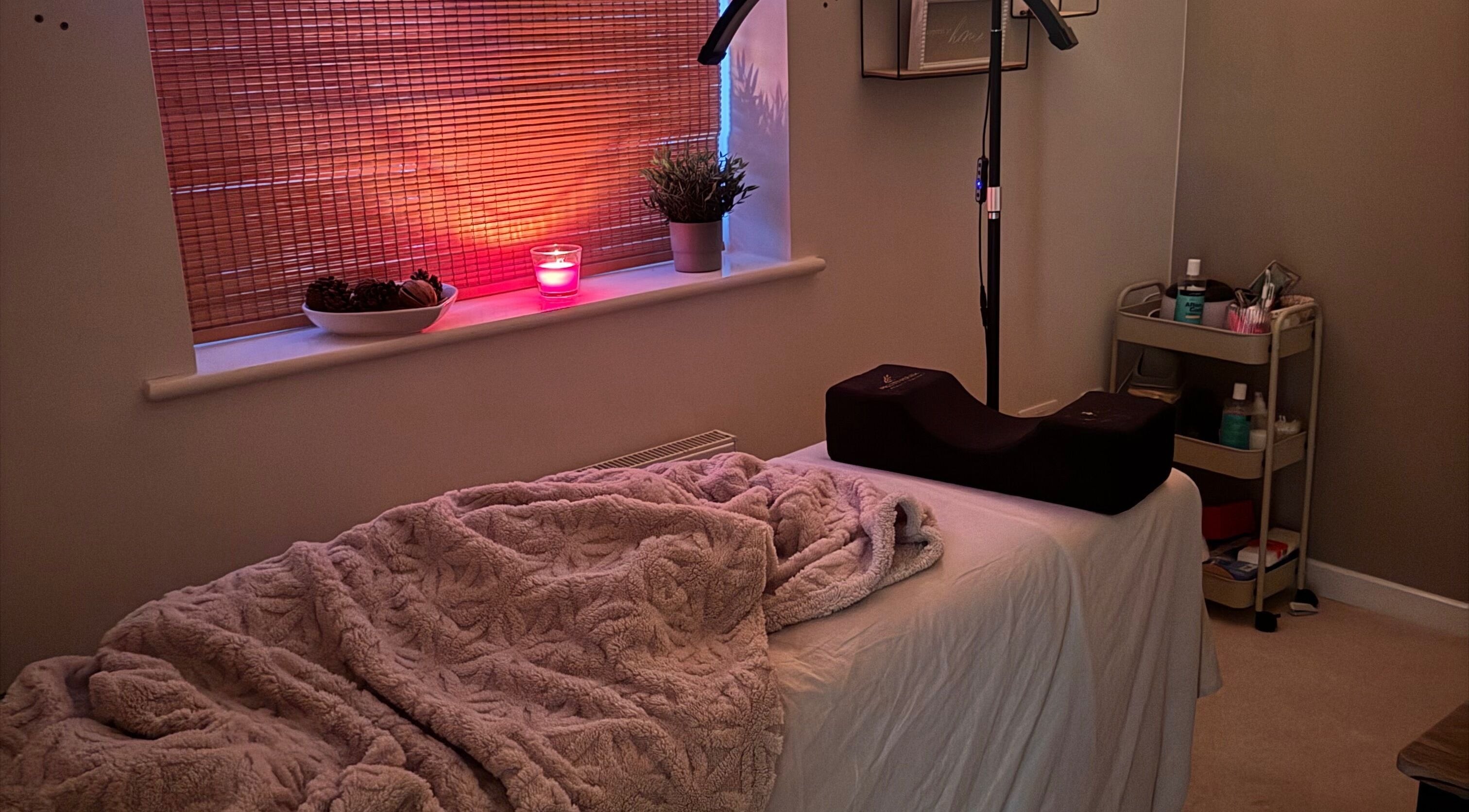 Relaxing treatment room at Brows By Ru, Royal Wootton Bassett, England, GB with ambient lighting and cozy decor.