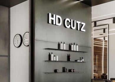 Interior of Hdcutz Leo, modern salon in London, England, GB with sleek design and product display.