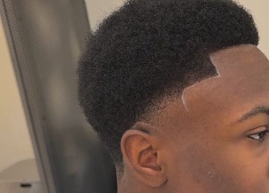 Sharp haircut at Hdcutz Leo in London, England, GB showcasing precise fade styling.