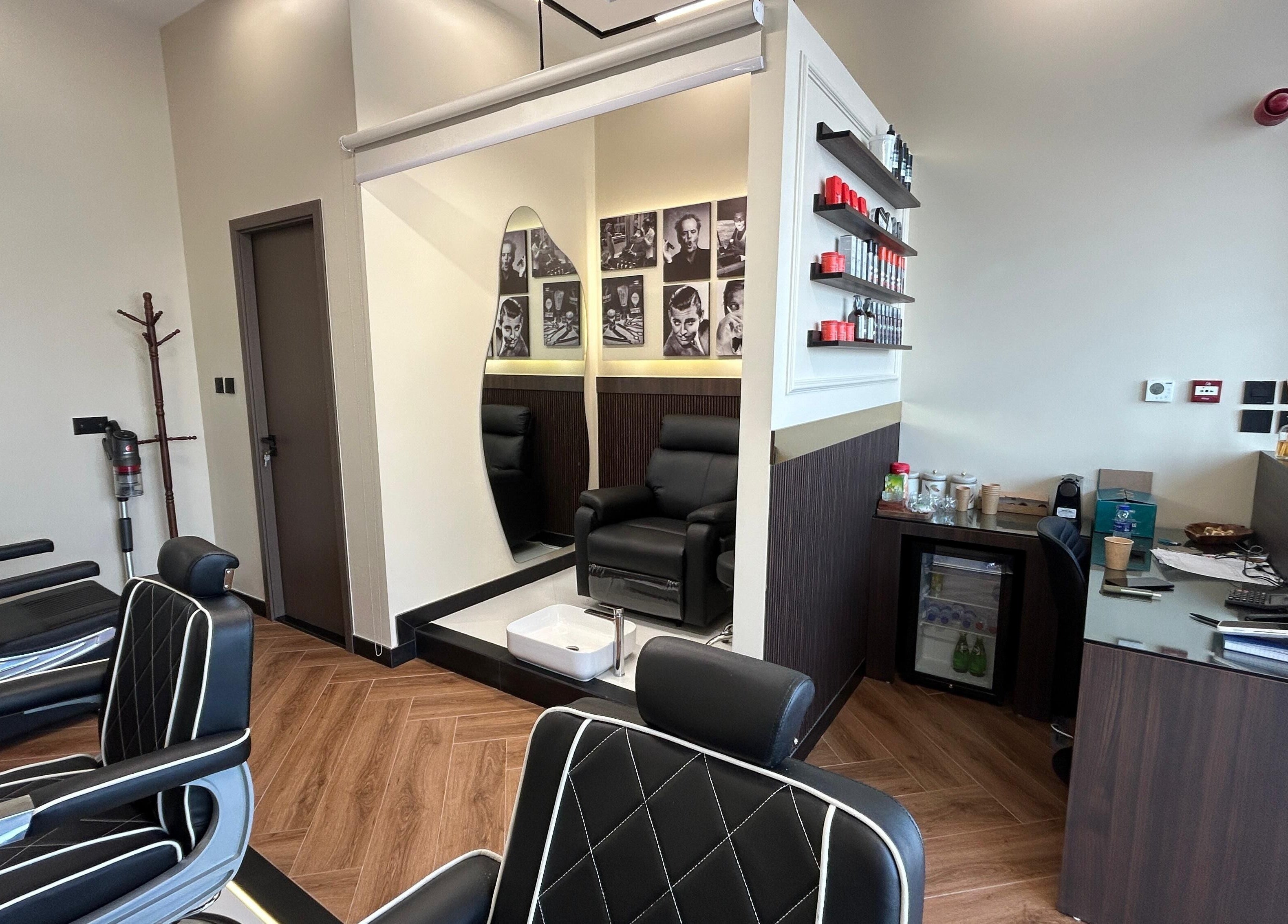 Sleek interior of Zero Double Seven Gents Salon, Dubai, Dubai, AE with modern barber chairs and stylish decor.