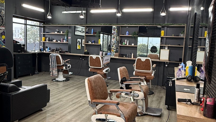 Modern interior of Lux Barbershop in Cockburn Central, Western Australia showcasing stylish barber chairs and decor.