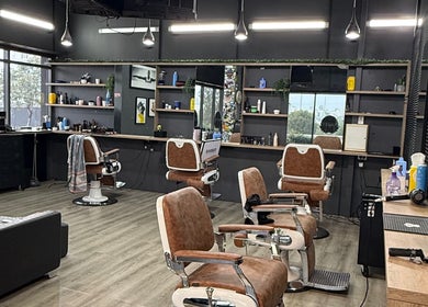 Modern interior of Lux Barbershop in Cockburn Central, Western Australia showcasing stylish barber chairs and decor.