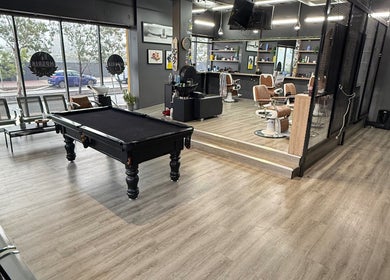 Lux Barbershop's modern interior with pool table in Cockburn Central, Western Australia, AU.