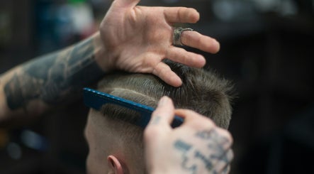 Experienced barber crafting a hairstyle at Lux Barbershop, Cockburn Central, Western Australia, AU.