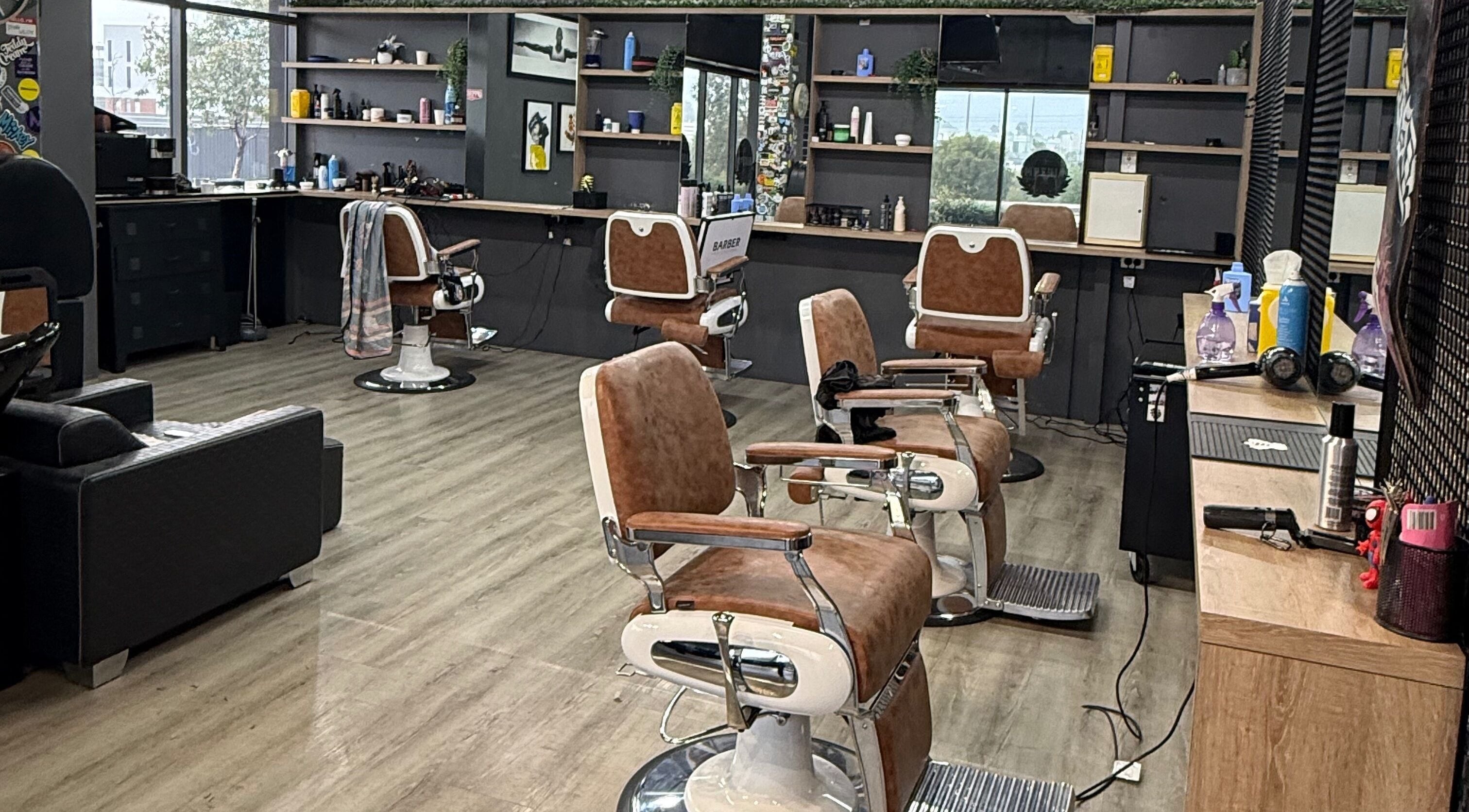 Interior of Lux Barbershop in Cockburn Central, Western Australia, AU featuring stylish barber chairs and modern decor.